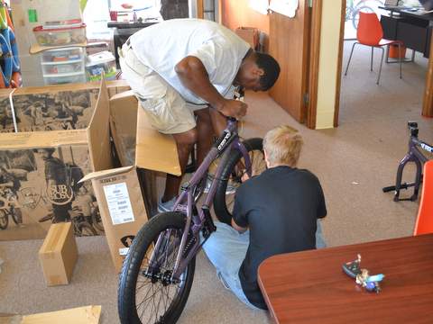 LaTour and a Student Finish Up a Bike