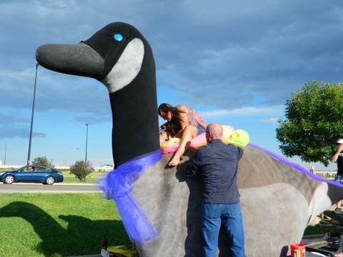 Bob DeLancey and Holly Burton Work on the Float
